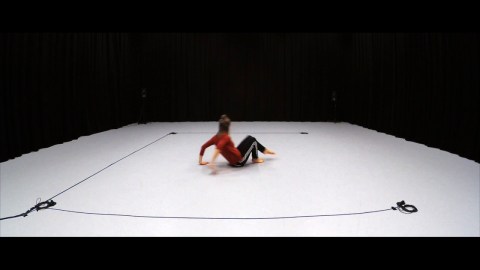 Dancer on a white stage in Subjective Dissonance
